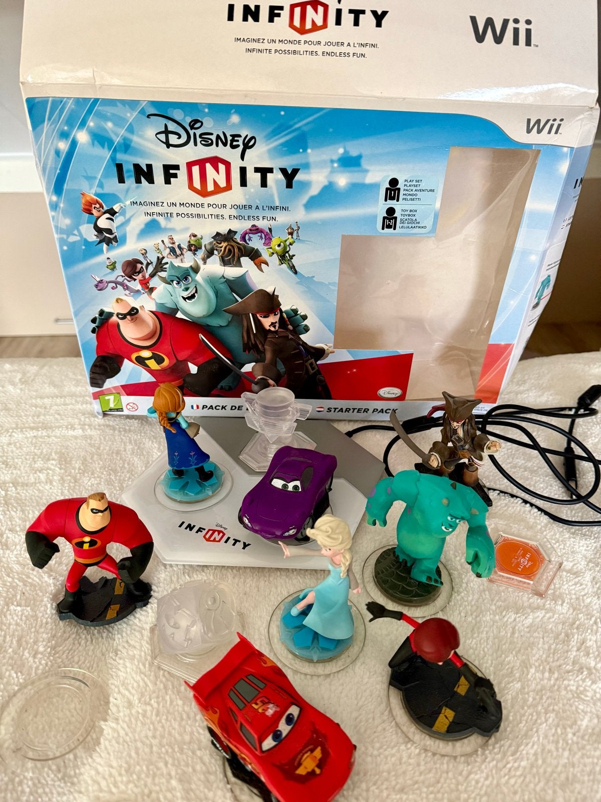 Disney Infinity Starter Pack Wii met extra figuren, Ophalen of Verzenden, Zo goed als nieuw, Zonder controller, Met games