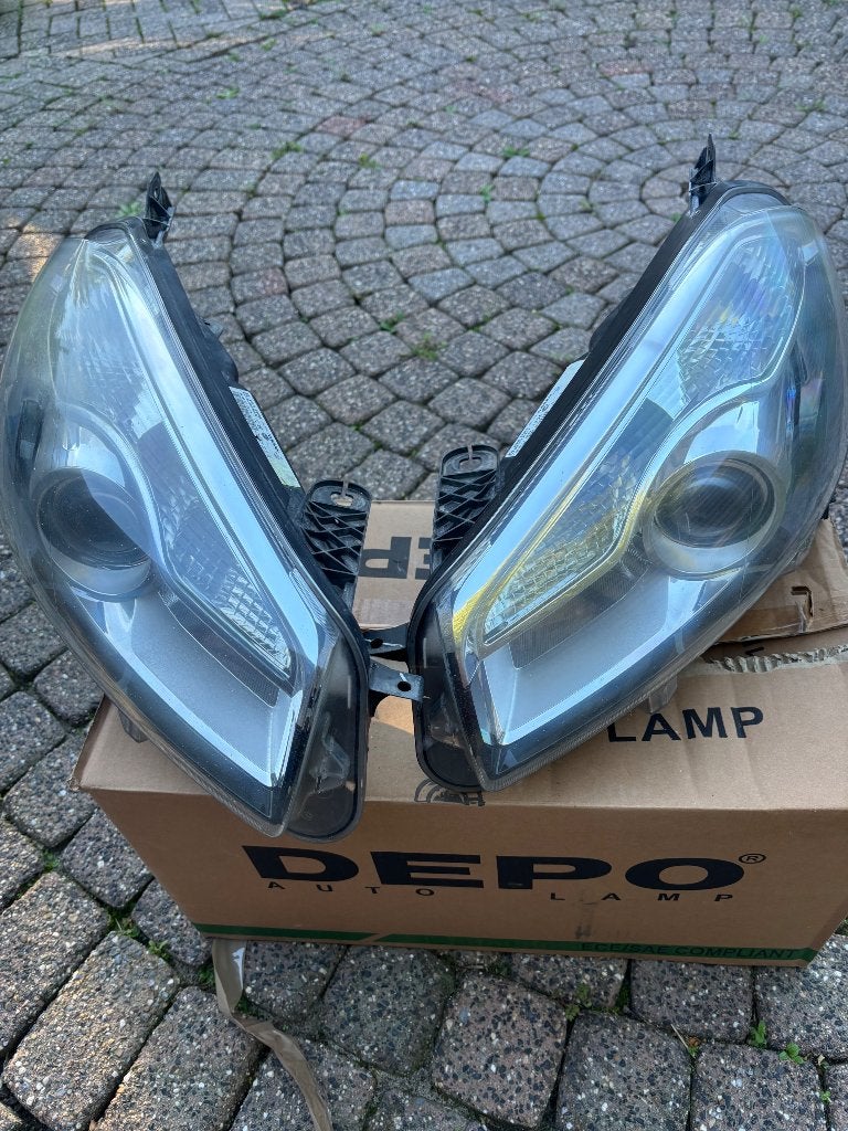 Originele Hella koplampen Nissan Qashqai J10 facelift – set