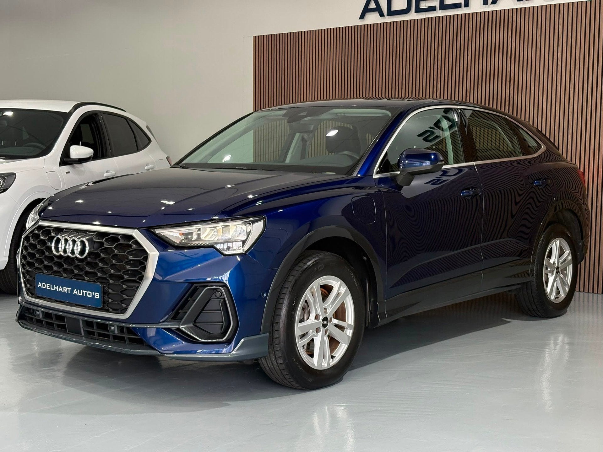 Audi Q3 Sportback 45 TFSI e Edition 245 PK Automaat / Naviga, Auto's, Zwart, Blauw, Hybride Elektrisch/Benzine, SUV of Terreinwagen