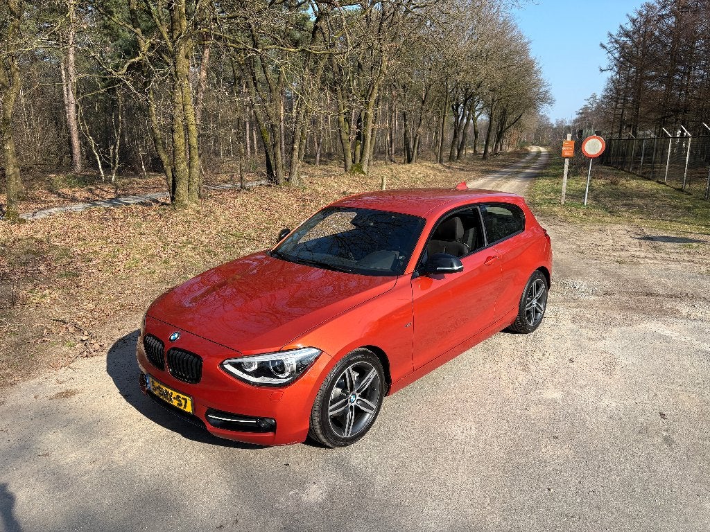 BMW 1-Serie 116I Valencia orange 2013, 1-Serie, Zwart, Origineel Nederlands, 19 km/l