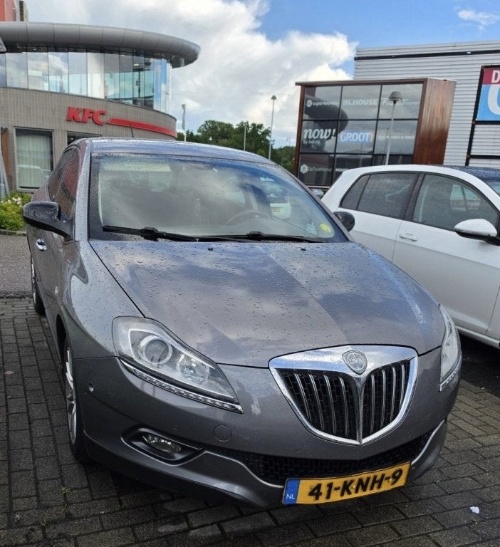 Lancia Delta 1.4-16V Oro (bj 2010), Auto's, Oldtimers, 15 km/l, Origineel Nederlands, Handgeschakeld, Zilver of Grijs