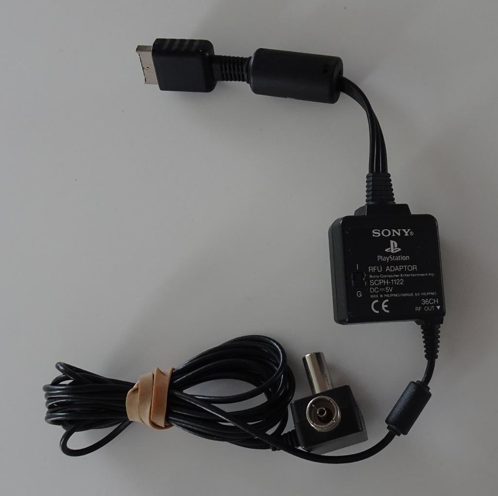 Sony SCPH-1122 RFU Adapter voor Sony PlayStation 1, Spelcomputers en Games, Games | Sony PlayStation 1, Zo goed als nieuw, Overige genres