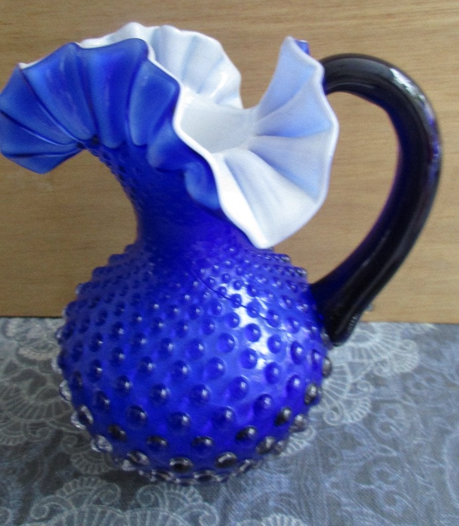 blauwe glazen vaas kruik  met oor ( met barst helaas), Blauw, Geschikt voor droogbloemen, Nieuw, Ophalen of Verzenden