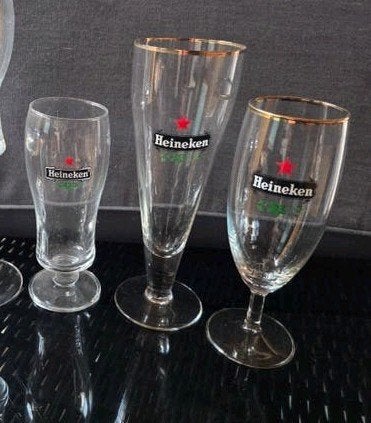 24 heineken glazen, verschillende, collectie, Ophalen of Verzenden, Zo goed als nieuw, Glas of Glazen, Heineken
