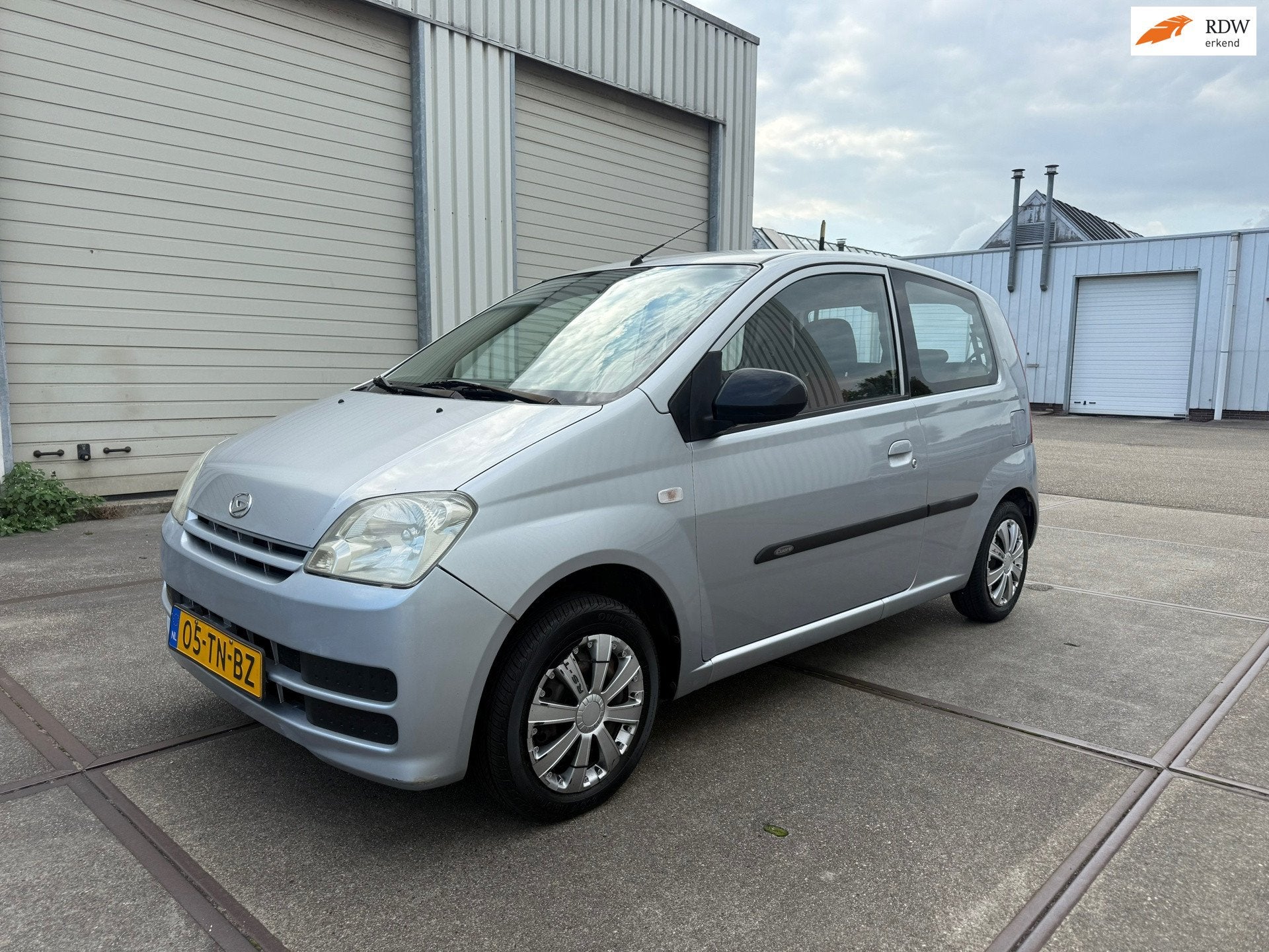 Daihatsu Cuore 1.0-12V Nagano, Auto's, Stof, Zwart, 18 €/maand, 4 stoelen