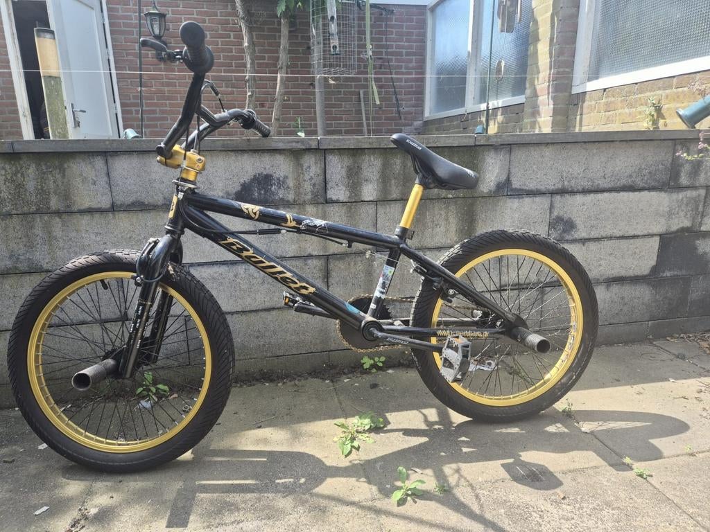 Stoere BMX fiets, zwart/goud, met voetsteunen, Ophalen, Gebruikt, Staal, Velgrem