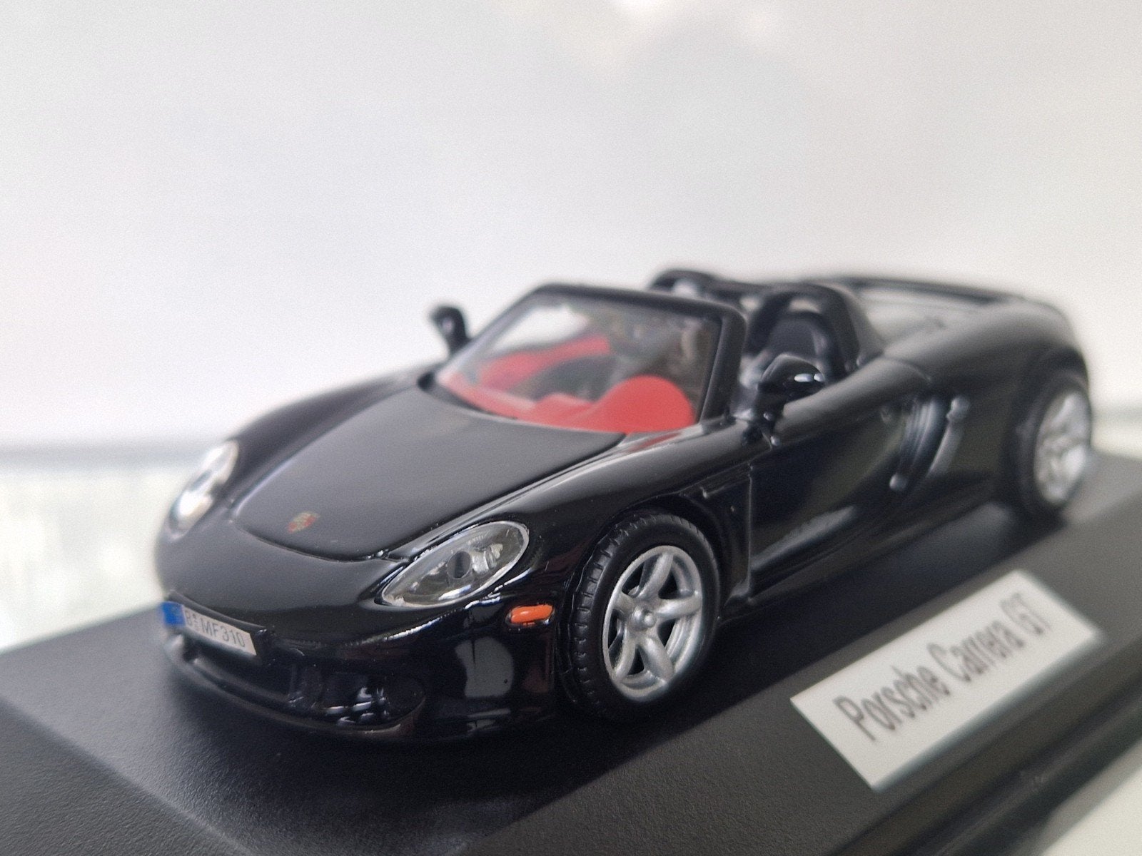 Porsche Carrera GT schaalmodel - Zwart, Hobby en Vrije tijd, Modelauto's | 1:43, Ophalen of Verzenden, Zo goed als nieuw