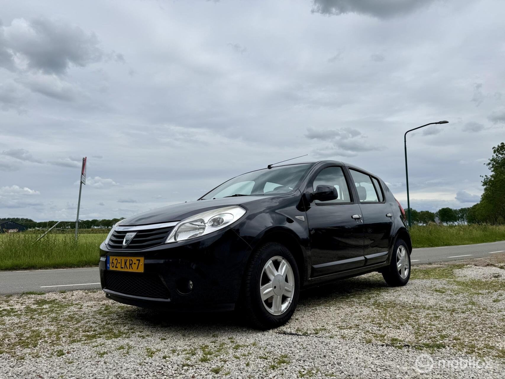 Dacia Sandero 1.4 Lauréate LPG, BJ 2010, Airco, APK Jun 202, Voorwielaandrijving, Gebruikt, 4 cilinders, Zwart