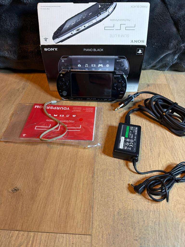 Sony PSP Slim & Lite Piano Black met doos en oplader, Ophalen of Verzenden, Zo goed als nieuw, Zwart, PSP Slim