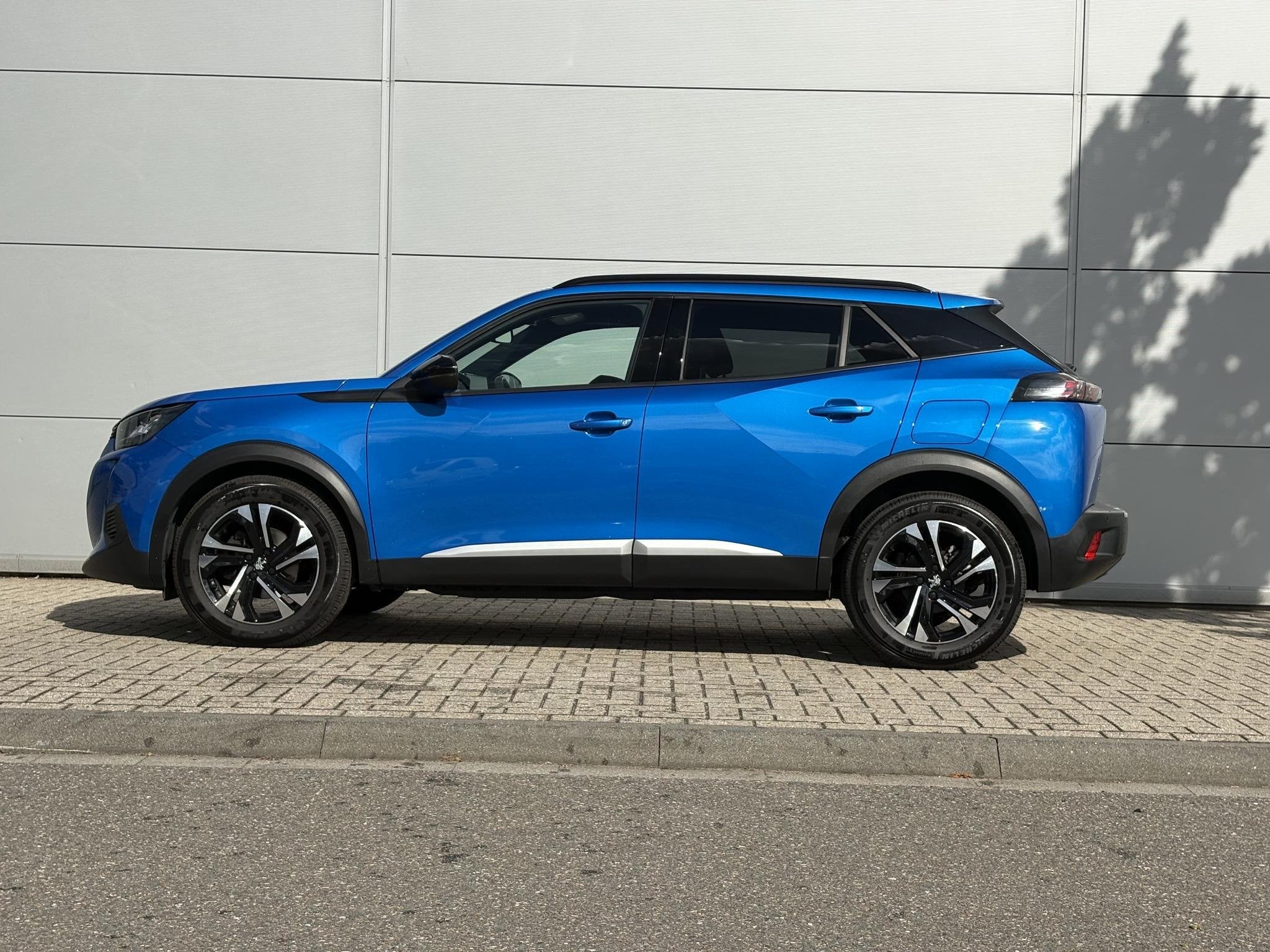 Peugeot 2008 1.2 PureTech Allure Pack | Camera | Navigatie |, Auto's, 12 maanden, Euro 6, 1199 cc, Blauw