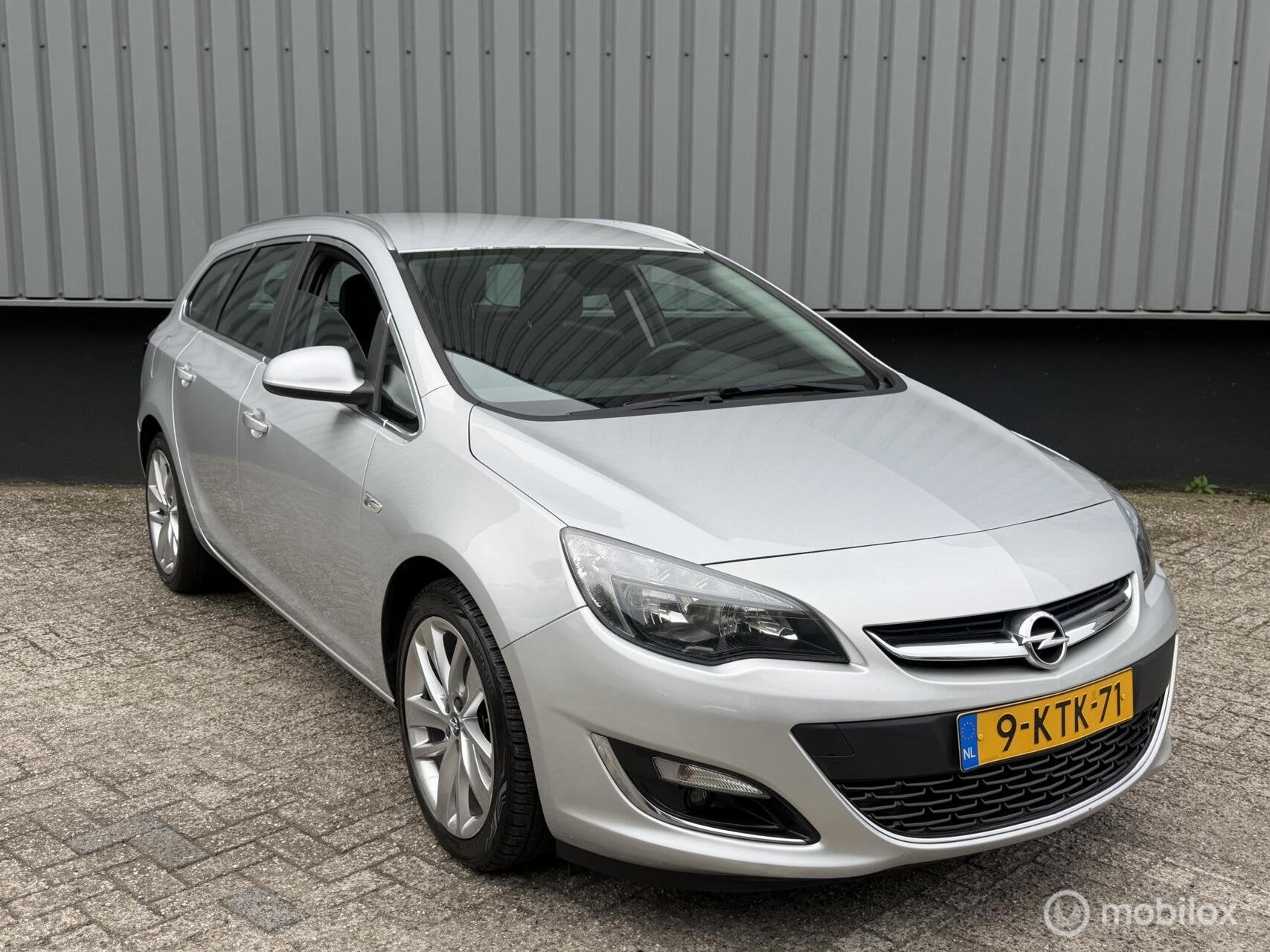 Opel Astra Sports Tourer 1.4 Turbo Cosmo, Auto's, Voorwielaandrijving, Euro 5, Gebruikt, Start-stop-systeem