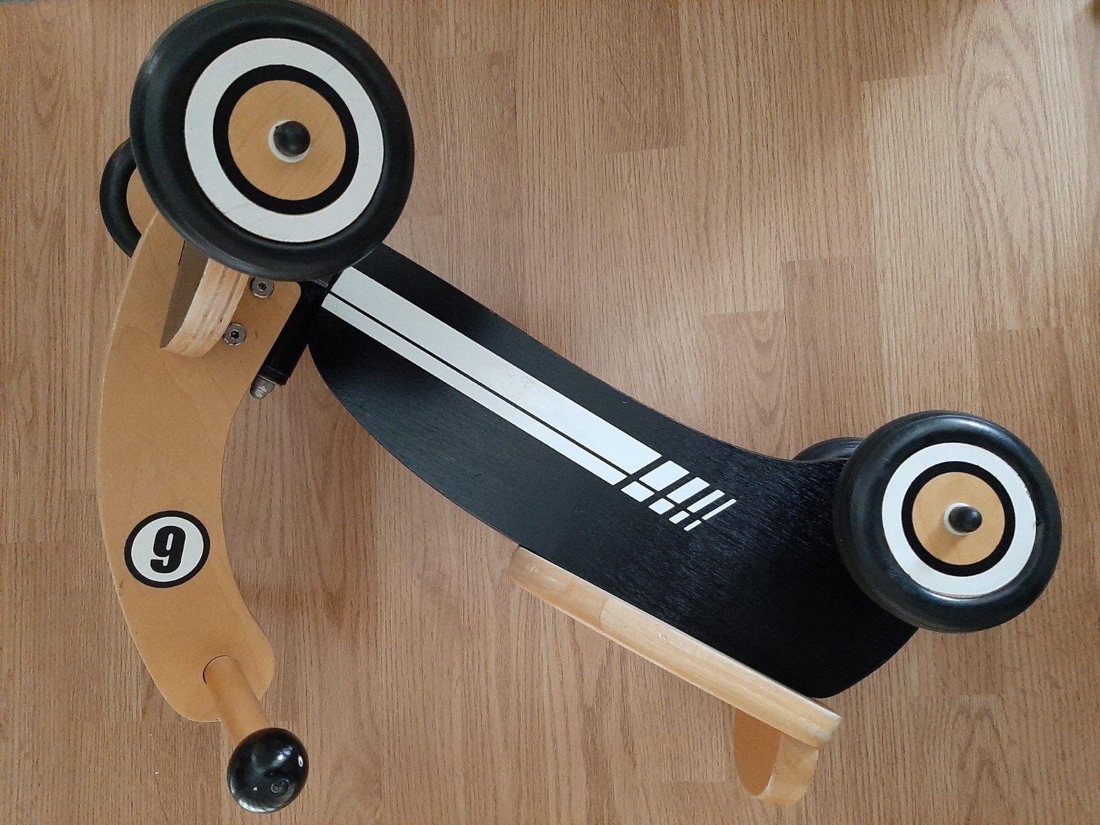 Houten speelgoed loopfietsje, Ophalen