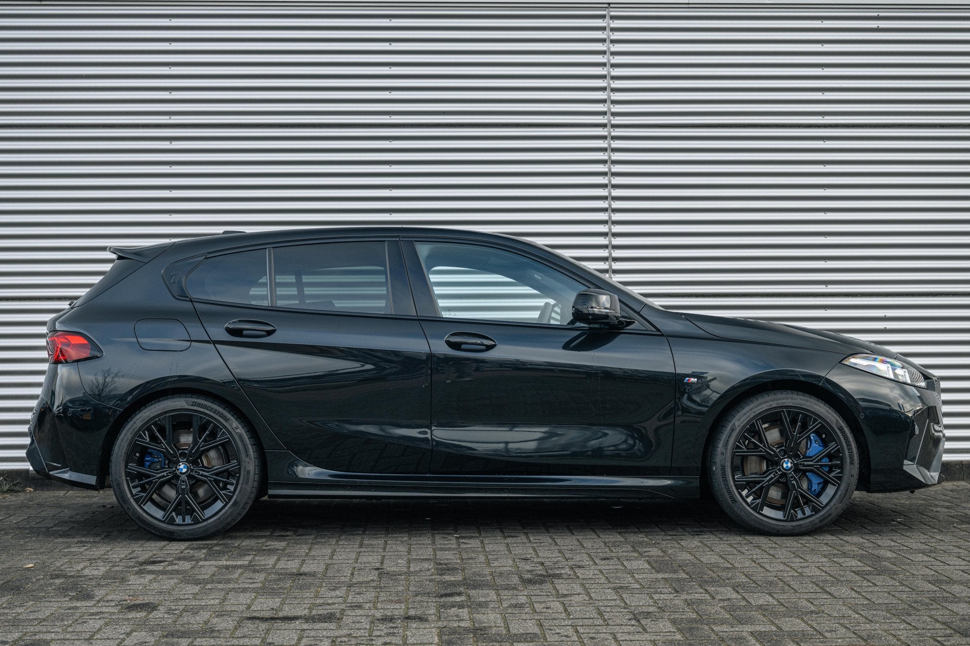 BMW 1 Serie M135 xDrive High Executive Automaat / Panoramada, Gebruikt, 4 cilinders, Met garantie (alle), Zwart