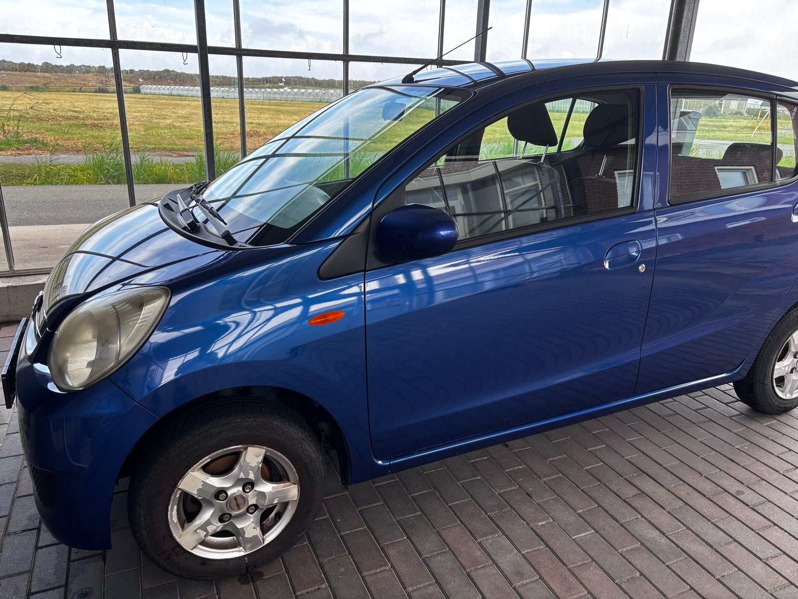 Daihatsu Cuore 1.0 2009 Blauw, Auto's, Voorwielaandrijving, 600 kg, Zwart, 18 €/maand