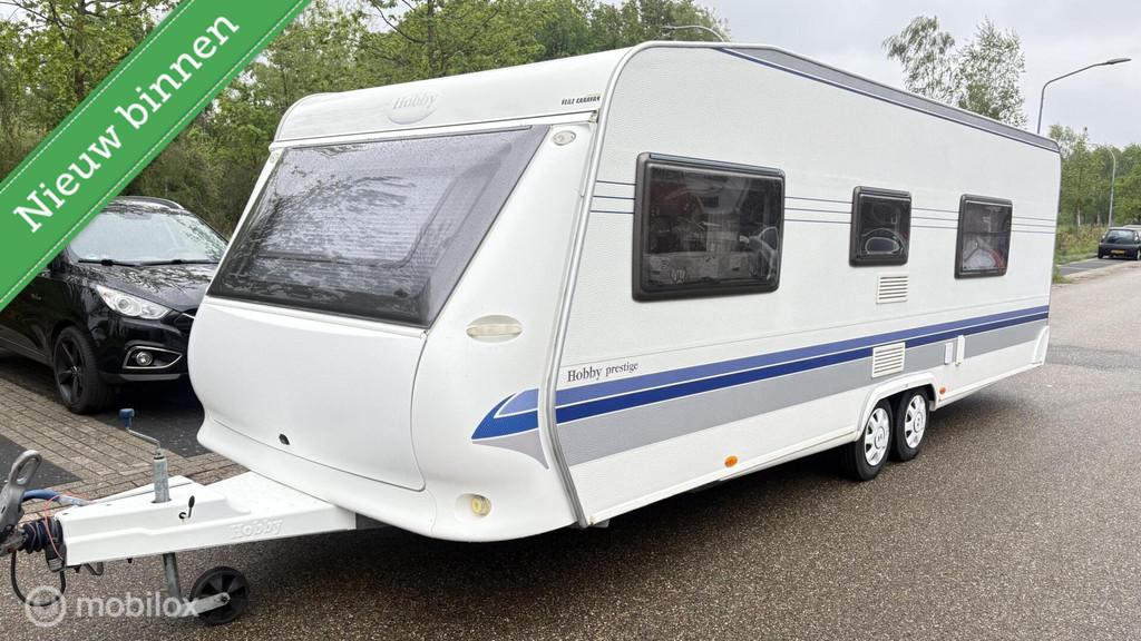 Hobby 650, prestige frans bed, Caravans en Kamperen, Caravans, Hobby, Hobby, Bedrijf, 8 meter en meer
