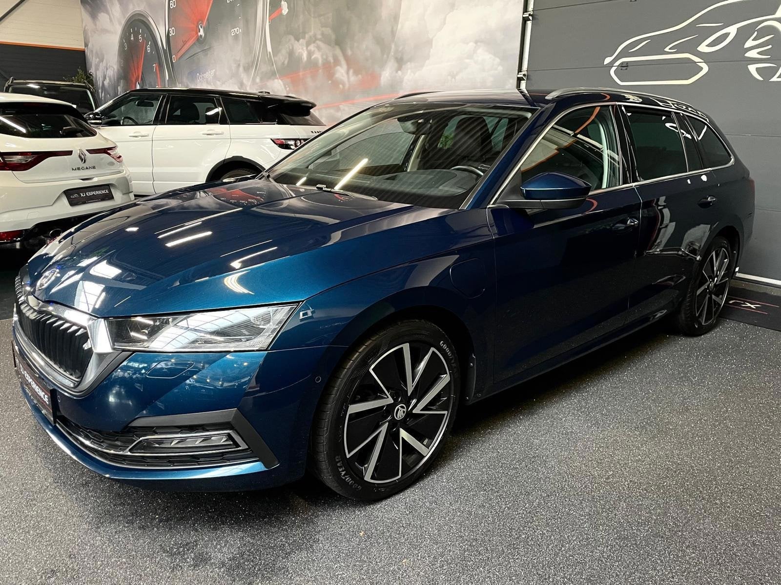 Skoda Octavia Combi 1.4 TSI Style iV Hybride 204 PK APPLE CA, Dealer onderhouden, Gebruikt, Blauw, Geïmporteerd