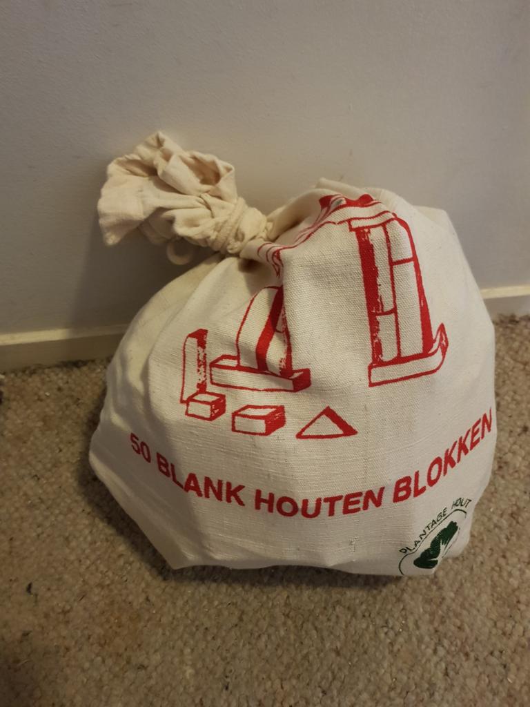 Zak met 50 blank houten blokken., Ophalen