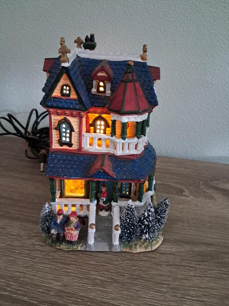 Kersthuisje voor in een kerstdorp, Ophalen