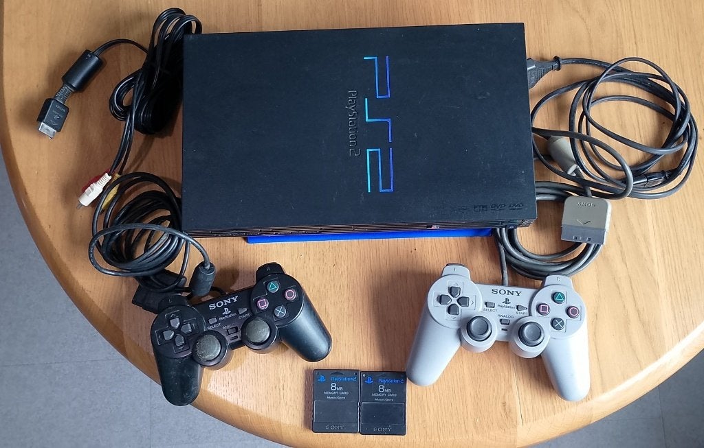 PS 2 set met 2 controllers, 2 memorycards en 14 games, Ophalen, Gebruikt, Phat, Met games