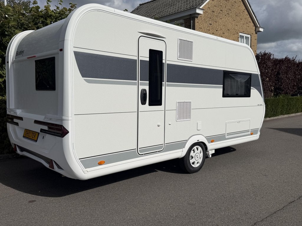 Hobby De Luxe 460 SL Moverpakket,nieuw ongebr., Caravans en Kamperen, Hobby, Bedrijf, Treinzit, Tot en met 3