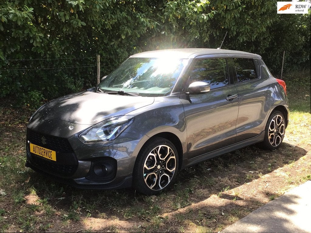 Suzuki Swift 1.4 Sport Smart Hybrid met verlengde garantie, Auto's, Voorwielaandrijving, Stof, Gebruikt, Zwart