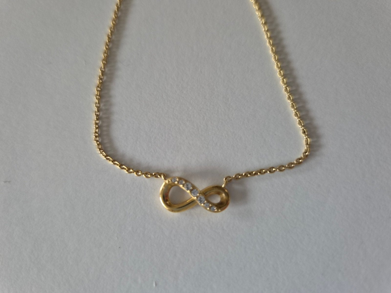 Zilveren ketting met goudkleurige coating - Infinity symbool, Sieraden, Tassen en Uiterlijk, Met kristal, Ophalen of Verzenden