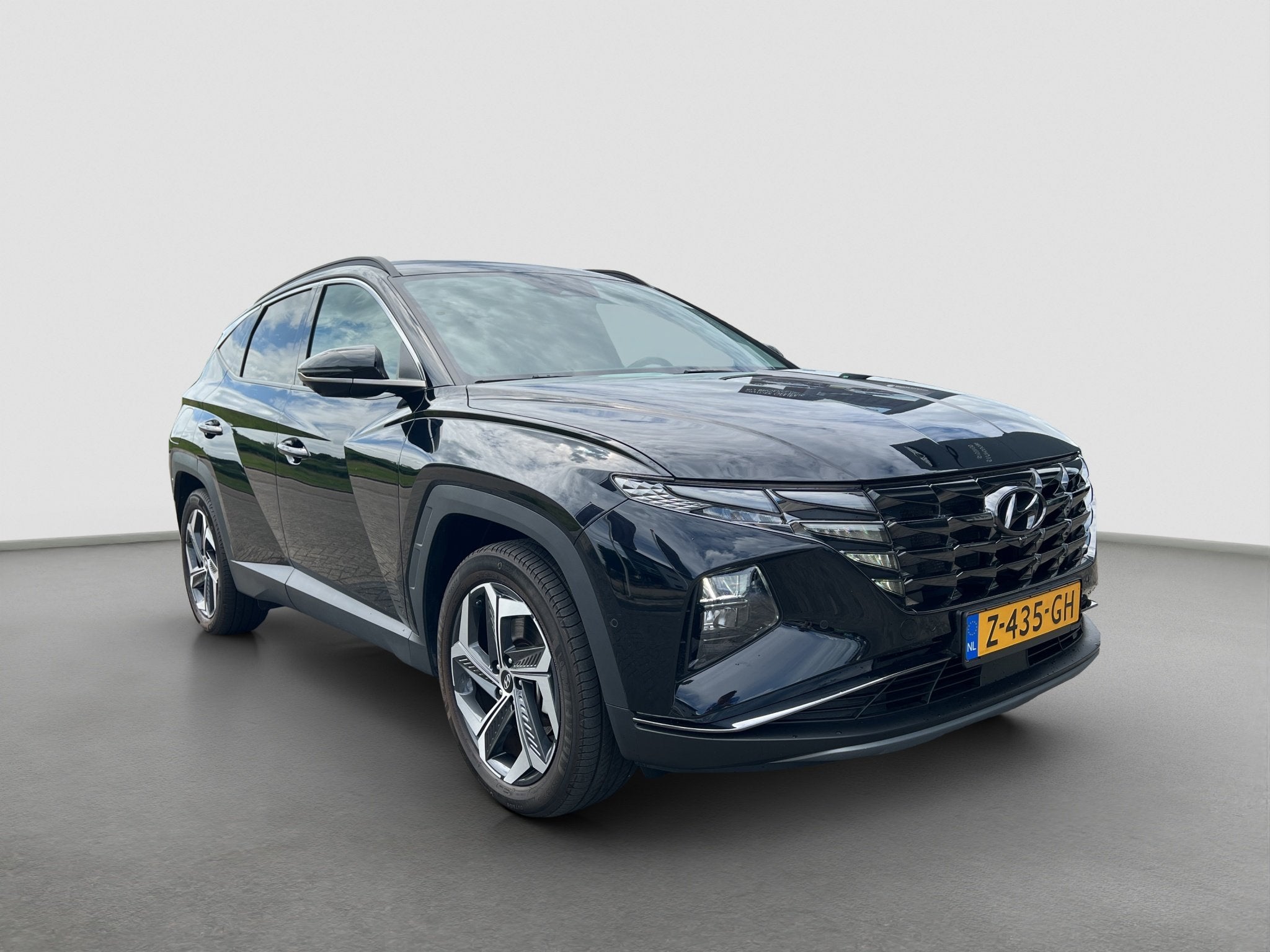 Hyundai TUCSON 1.6 T-GDI 265pk PHEV Premium 4WD, Auto's, Gebruikt, 4 cilinders, Zwart, Bedrijf
