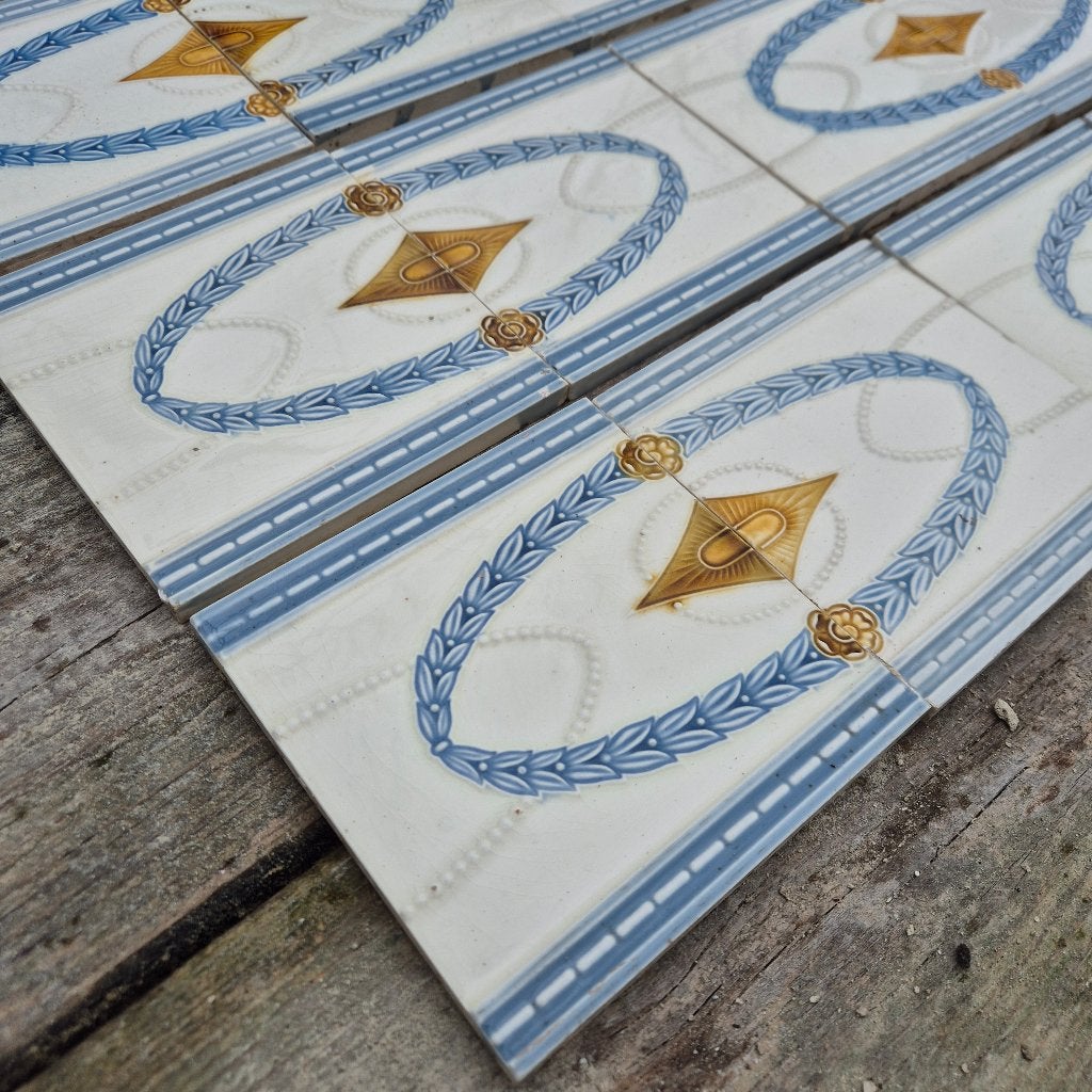 63 Art nouveau randtegels opgelegd decor blauw goudbruin, Ophalen