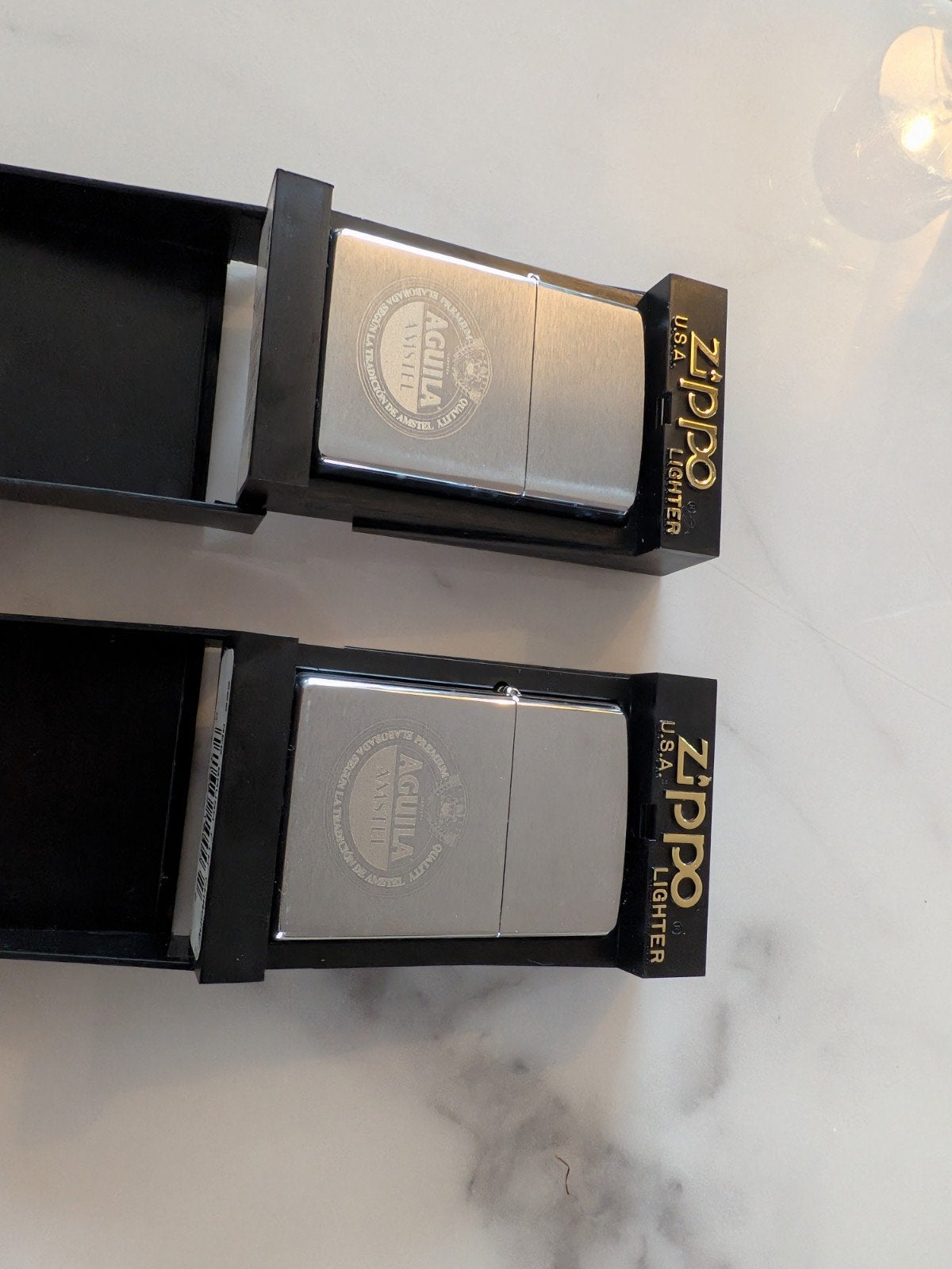 2x Zippo Amstel Aquila 1990, Verzamelen, Ophalen of Verzenden, Nieuw, Aansteker