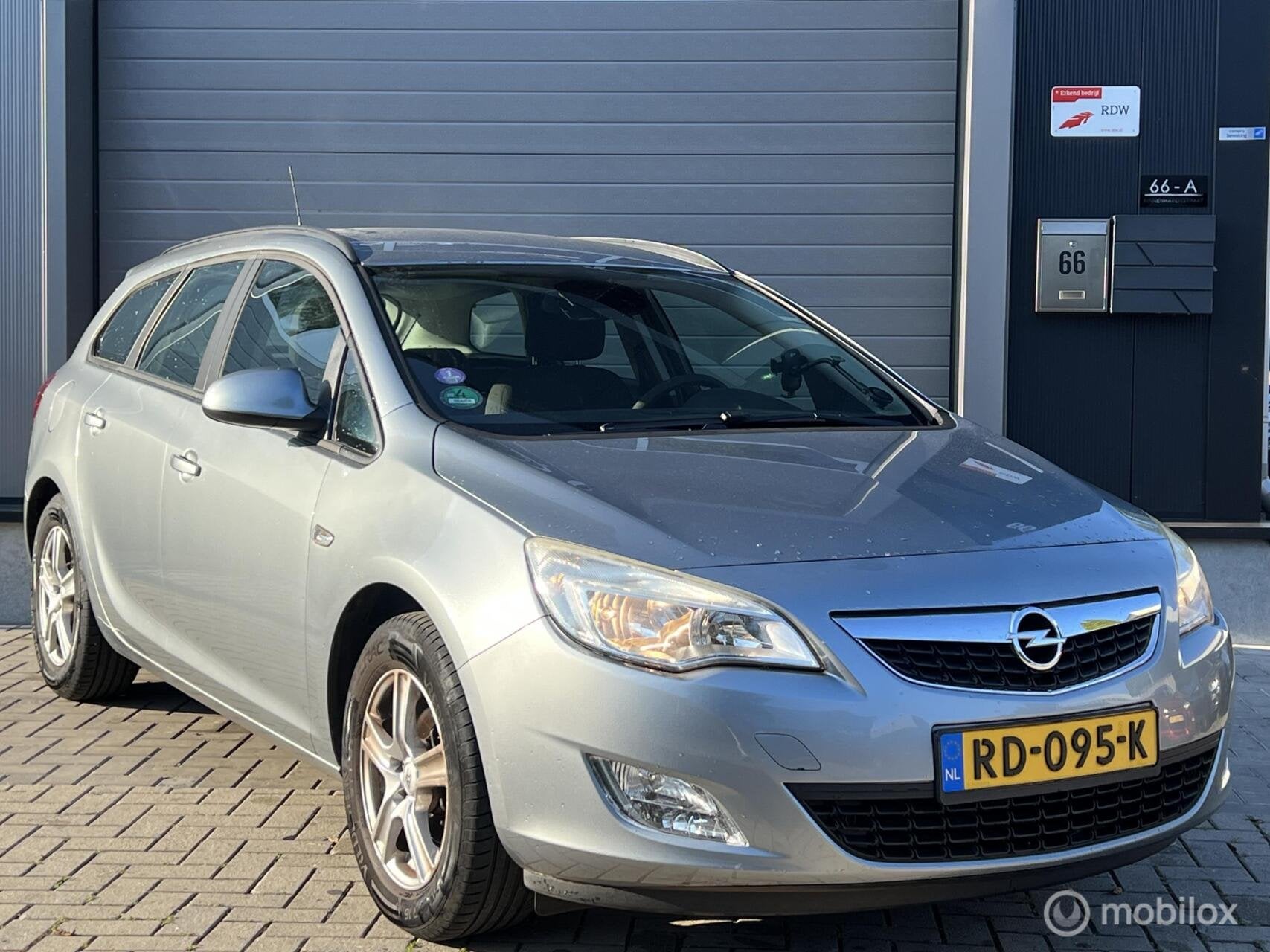 Opel Astra Sports Tourer 1.4 Turbo Sport, Voorwielaandrijving, Euro 5, Gebruikt, 4 cilinders