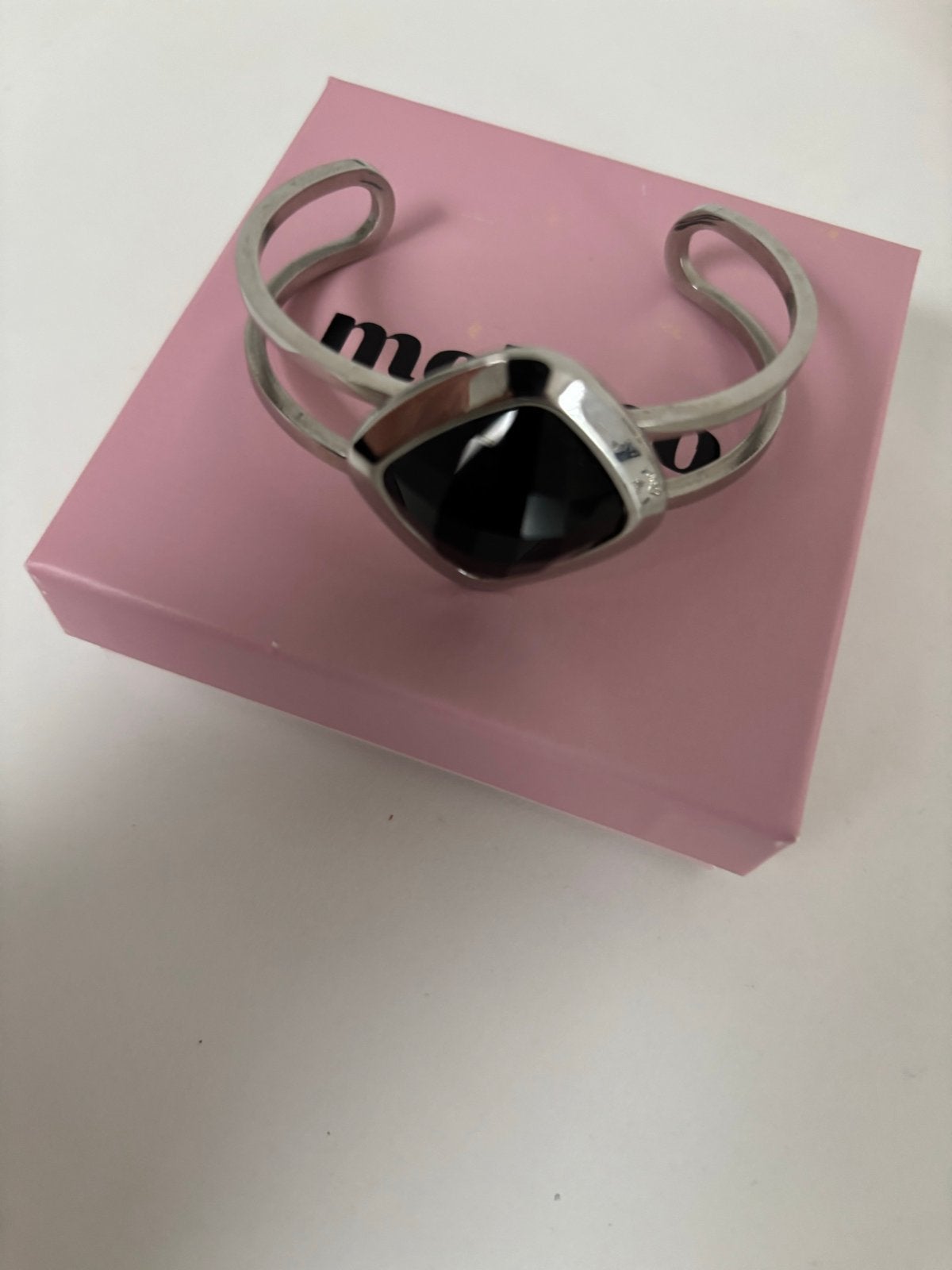Melano Kosmic armband maat M met zwarte steen, Staal, Ophalen of Verzenden, Zo goed als nieuw, Met edelsteen