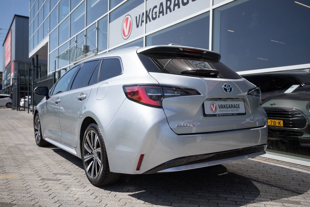 Toyota Corolla Touring Sports 1.8 Hybrid Dynamic Style, Gebruikt, 750 kg, 4 cilinders, Automatische klimaatregeling