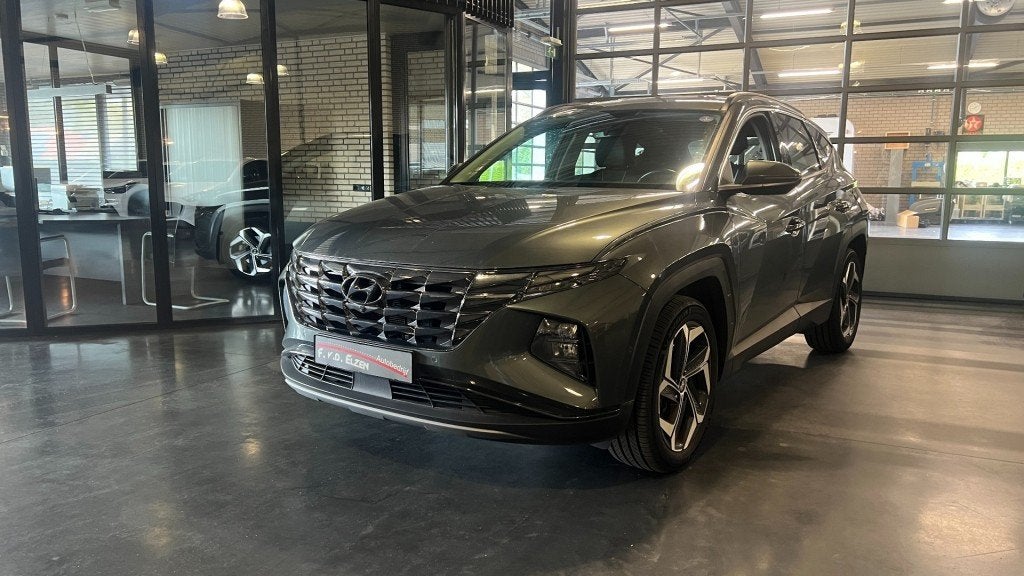 Hyundai TUCSON 1.6 T-GDI HEV Premium 230 Pk Automaat 1650 kg, Auto's, Gebruikt, Huisgarantie, 4 cilinders, Met garantie (alle)