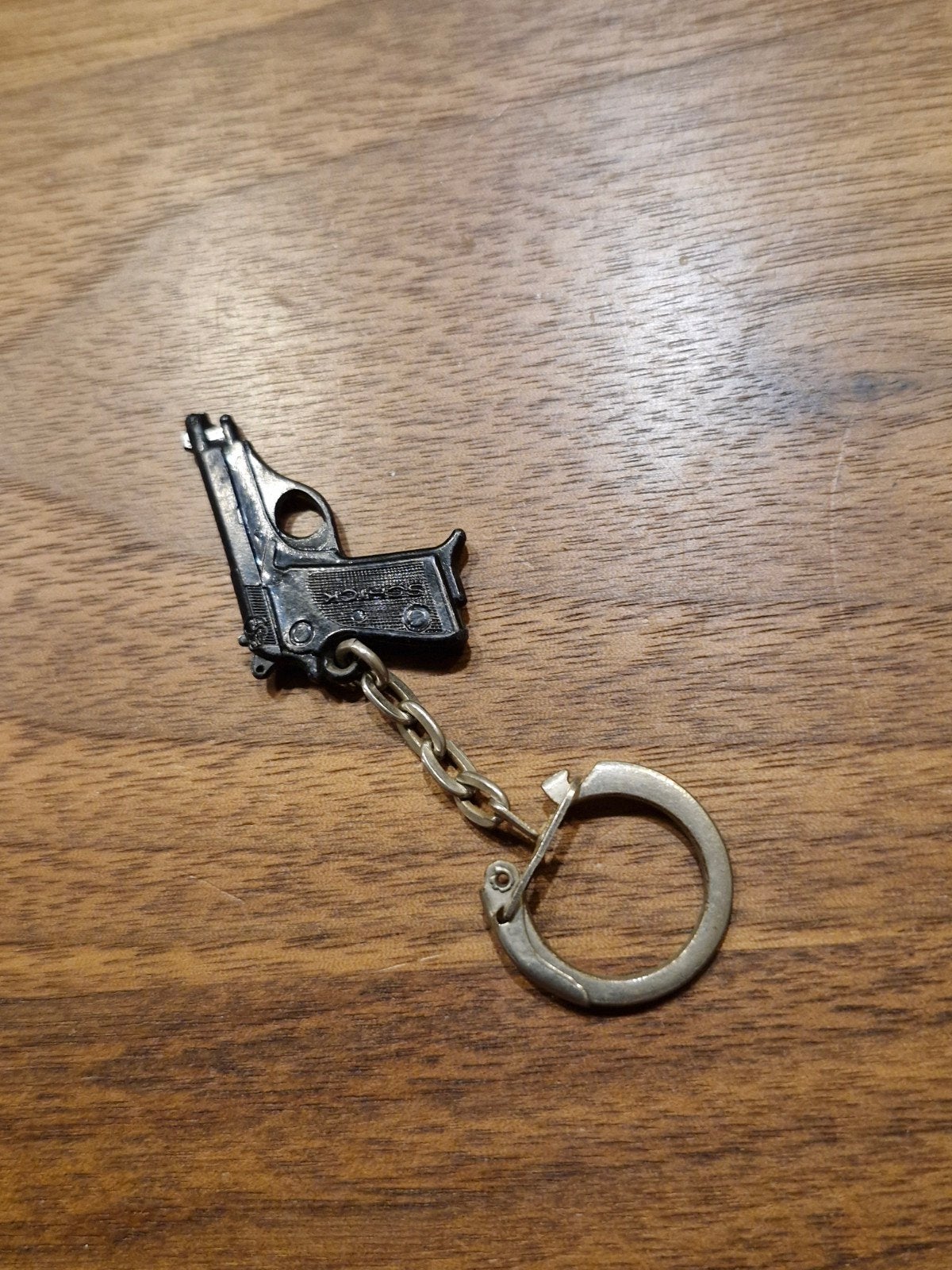 054 Plastic pistool sleutelhanger, Ophalen of Verzenden, Gebruikt, Overige typen