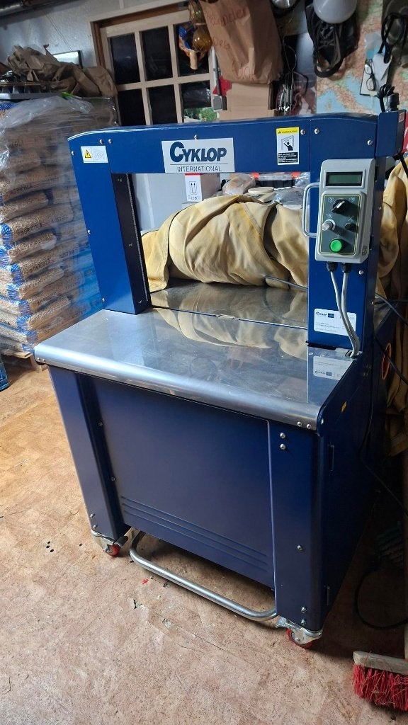 Cyklop inpakmachine bandagemachine, Ophalen