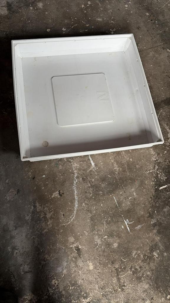 Opvangbak wasmachine, Ophalen