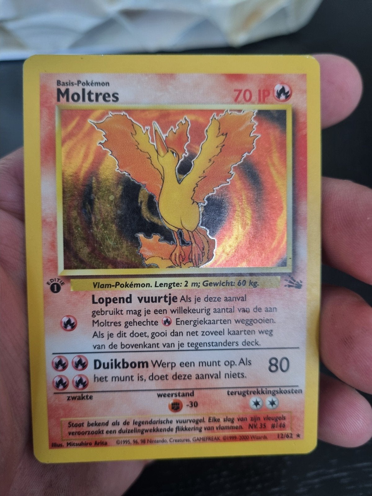 moltres 12 /62 fossil NL 1e editie , holo rare * € 60, Hobby en Vrije tijd, Verzamelkaartspellen | Pokémon, Ophalen of Verzenden