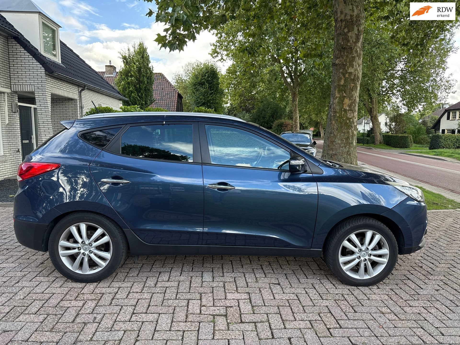 Hyundai Ix35 2.0i 4WD Active automaat, Auto's, Automaat, Gebruikt, Zwart, 4 cilinders