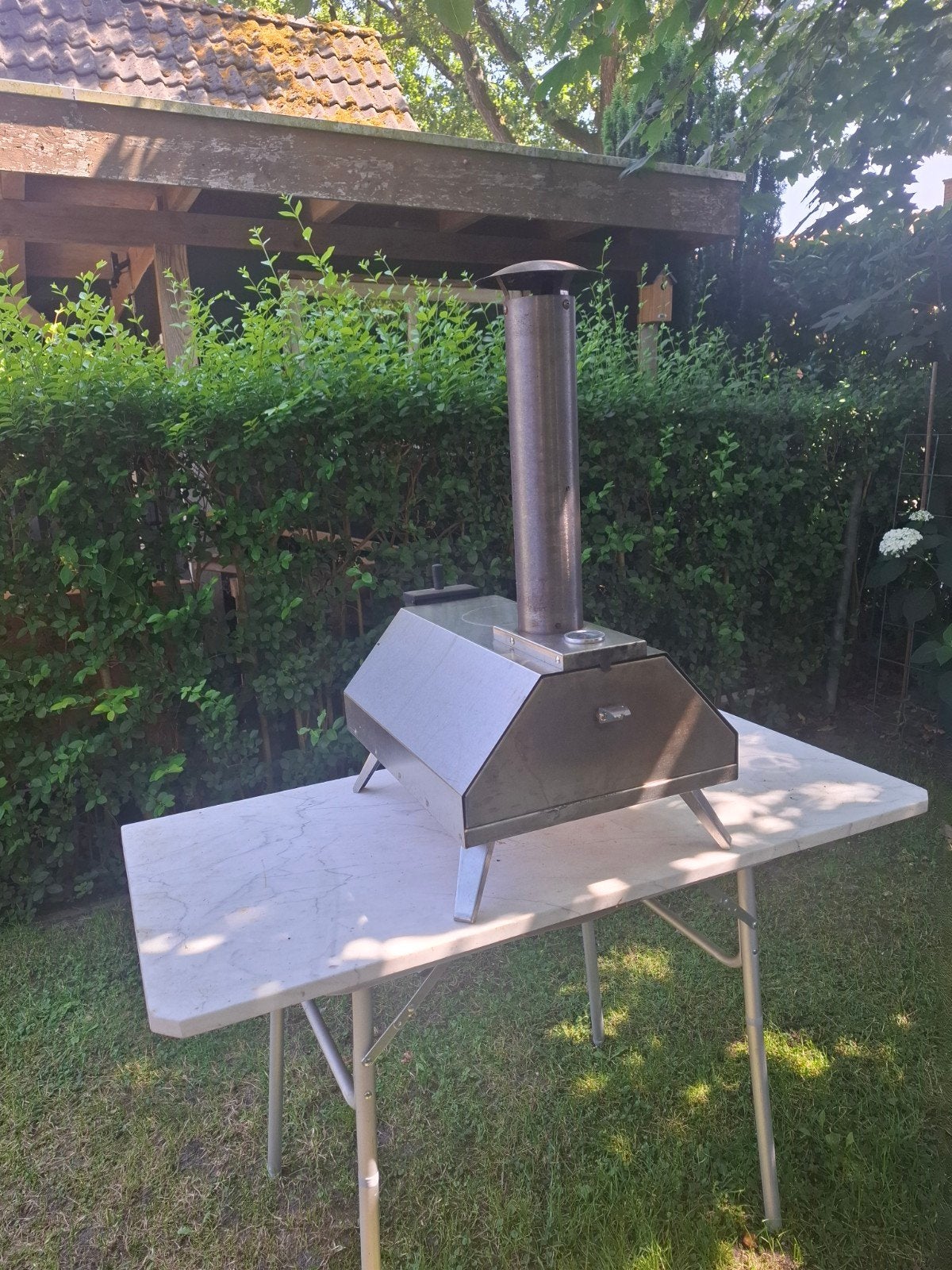 Pizza oven met marmeren plaat, Ophalen