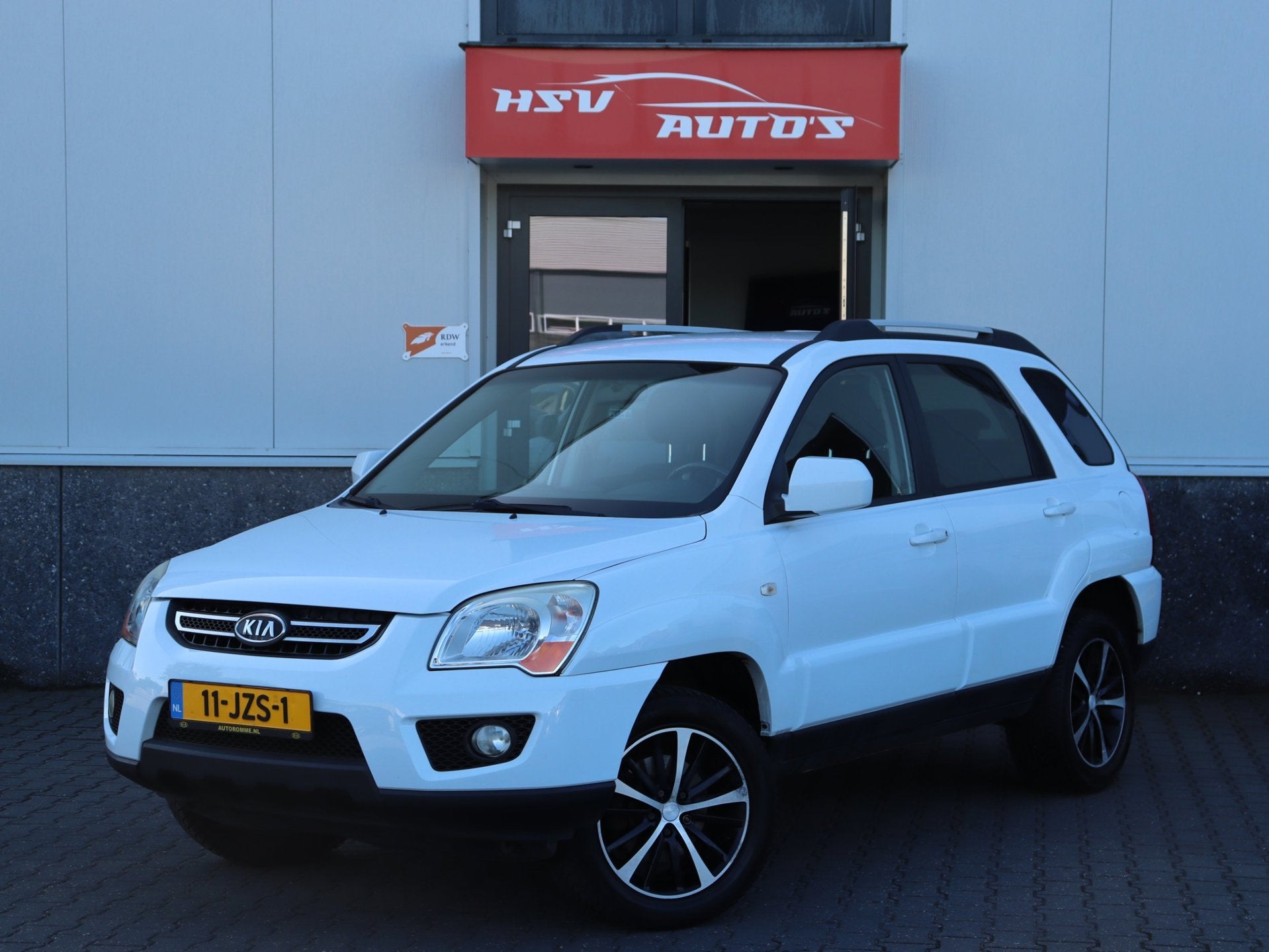 Kia Sportage 2.0 CVVT X-tra navi LEER trekhaak org NL, Auto's, 1442 kg, Gebruikt, 4 cilinders, Wit
