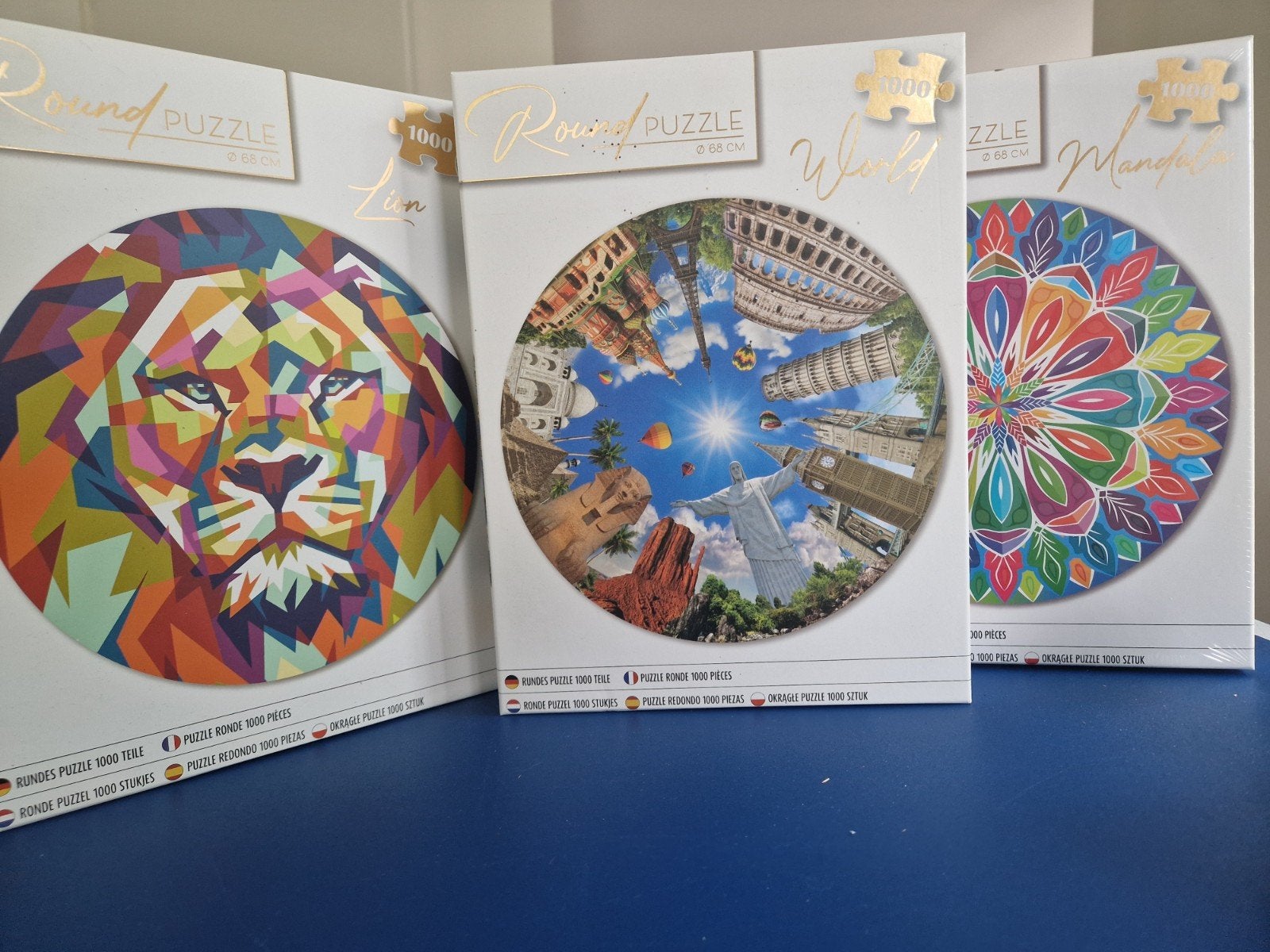 3 Ronde legpuzzels 1000 stukjes: Leeuw, Wereld, Mandala, Ophalen of Verzenden, 500 t/m 1500 stukjes, Zo goed als nieuw, Legpuzzel