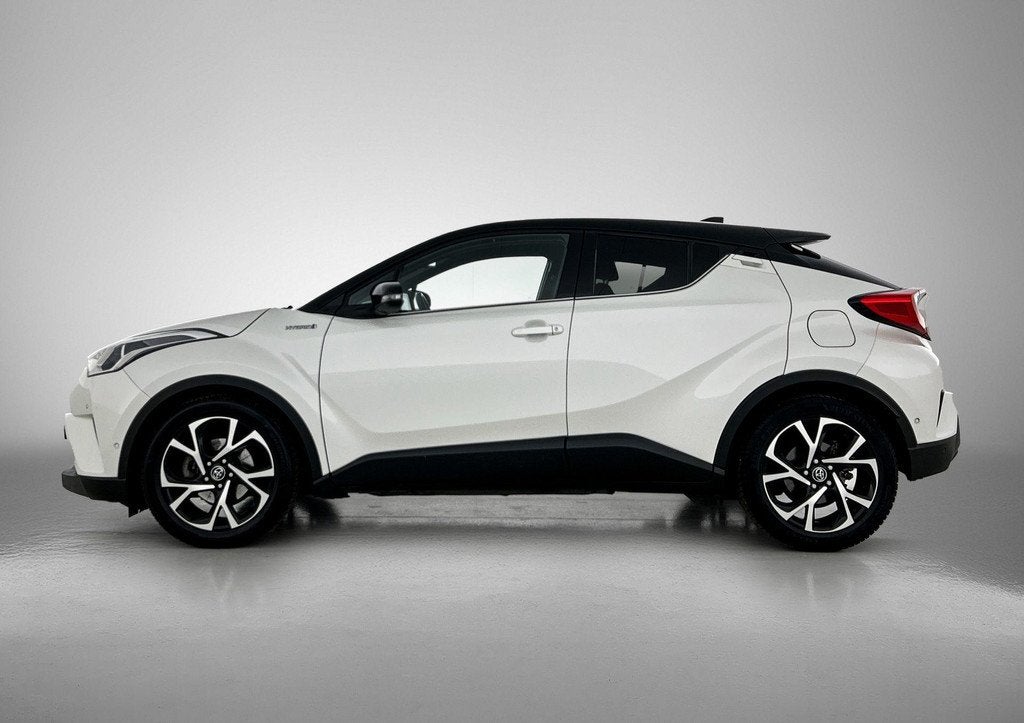 Toyota C-HR 1.8 Hybrid Bi-Tone Plus | Airco | Achteruitrijca, Auto's, Toyota, Stof, Euro 6, 4 cilinders, 26 km/l