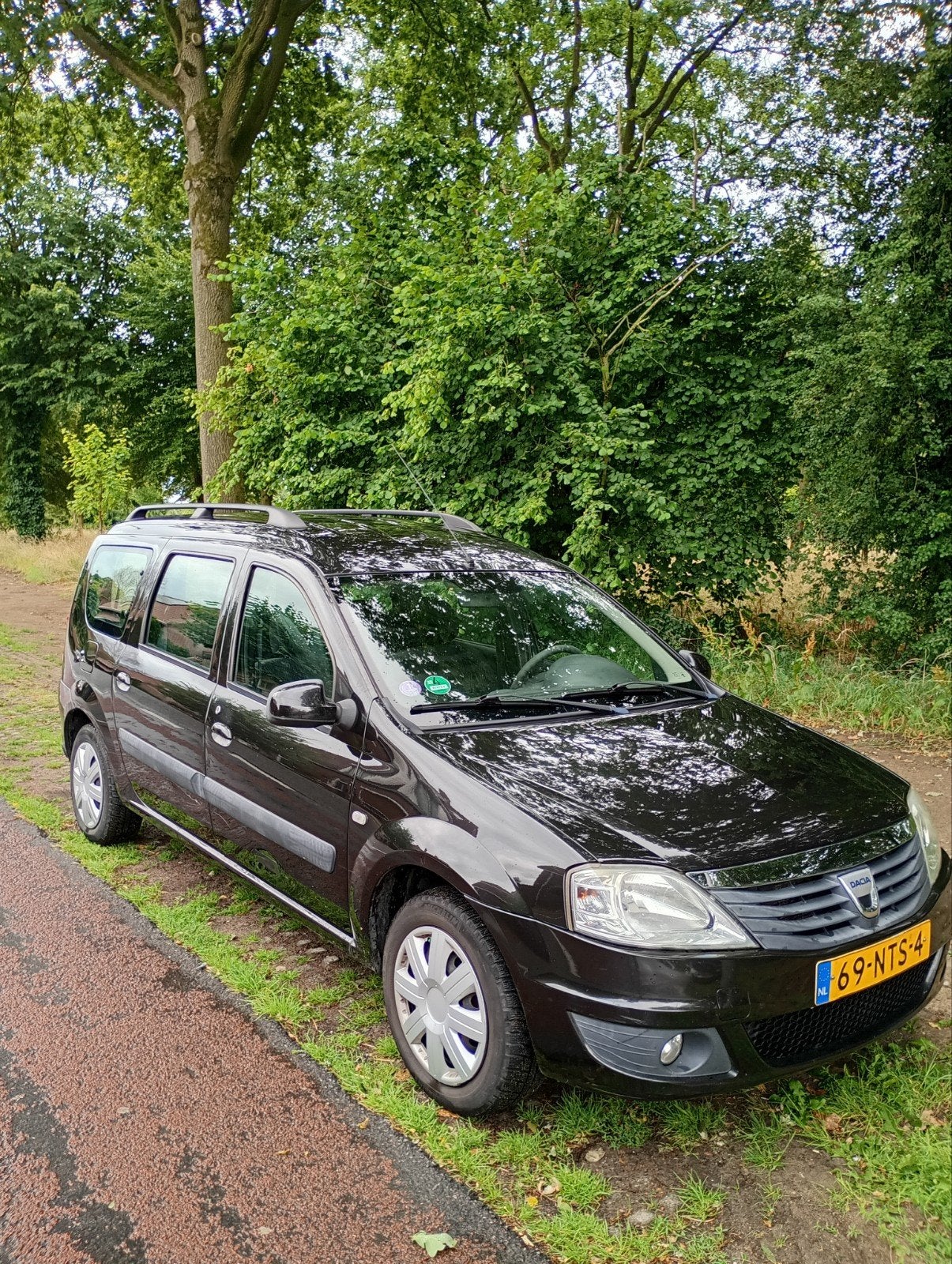 Dacia Logan 1.6 16V LPG G3 MCV 77KW 7P 2010 Zwart apk 5-27, Auto's, Dacia, Stof, 4 cilinders, 1261 kg, 7 stoelen