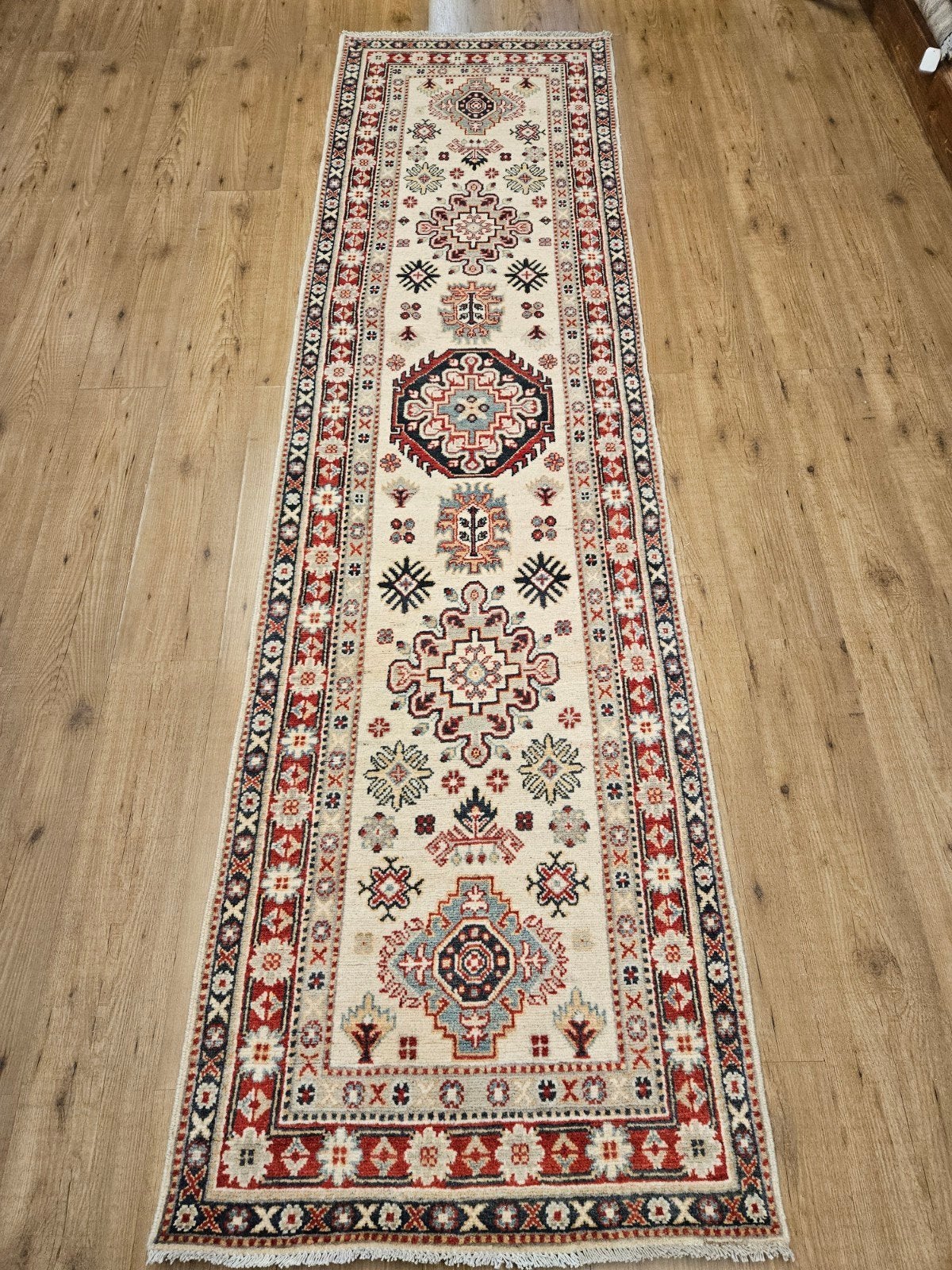 Handgeknoopt oosters tapijt loper kazak 299x82