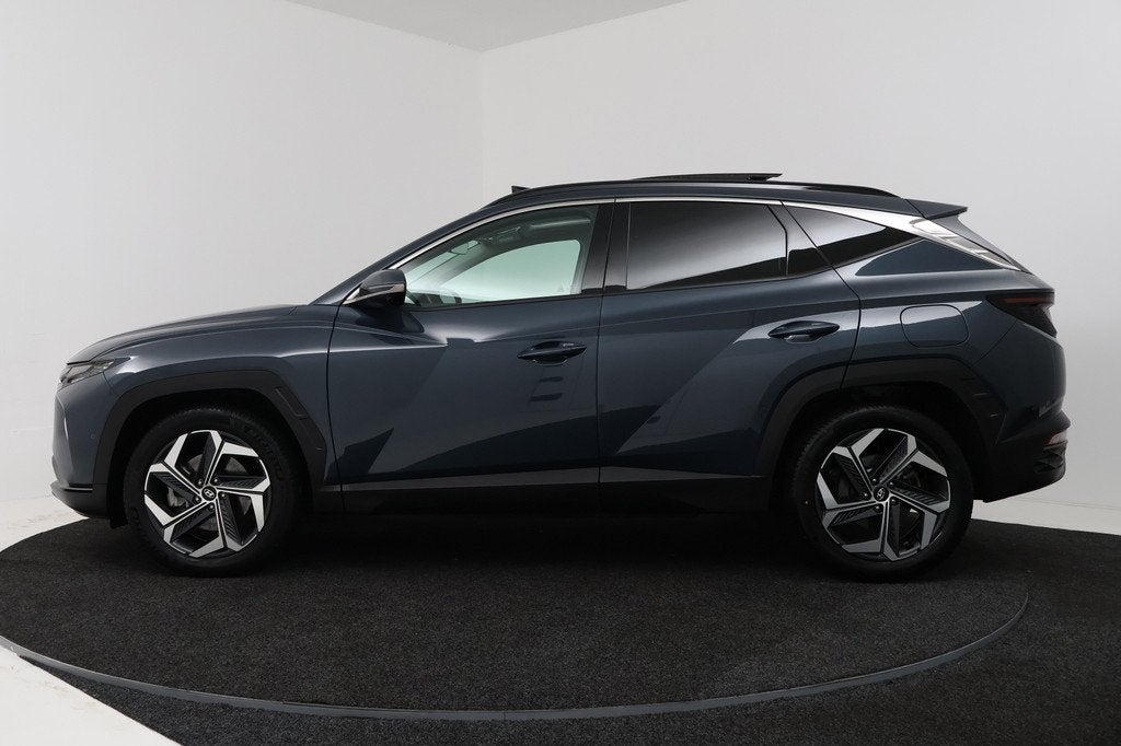 Hyundai Tucson 1.6 T-GDI HEV Premium Sky (PANORAMADAK, TREKH, Auto's, Hyundai, Gebruikt, 4 cilinders, Blauw, 1650 kg