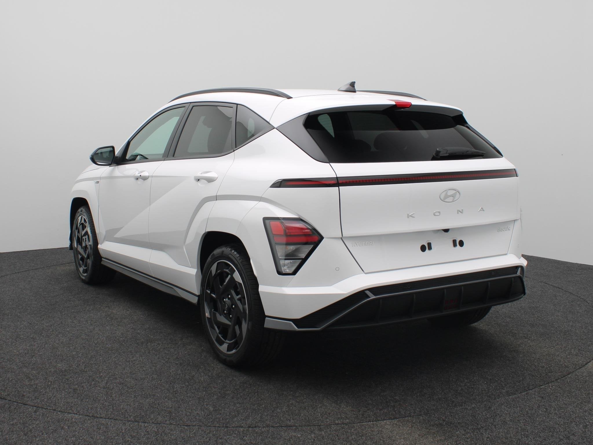 Hyundai Kona Electric N Line Business 64.8 kWh | Warmtepomp, Auto's, Stof, Wit, Origineel Nederlands, 420 min