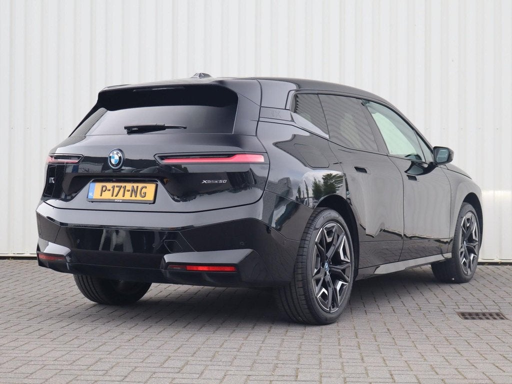 BMW iX xDrive50 524pk High Executive 112 kWh | SoH 96% | Har, Auto's, Automaat, Gebruikt, 523 pk, Zwart
