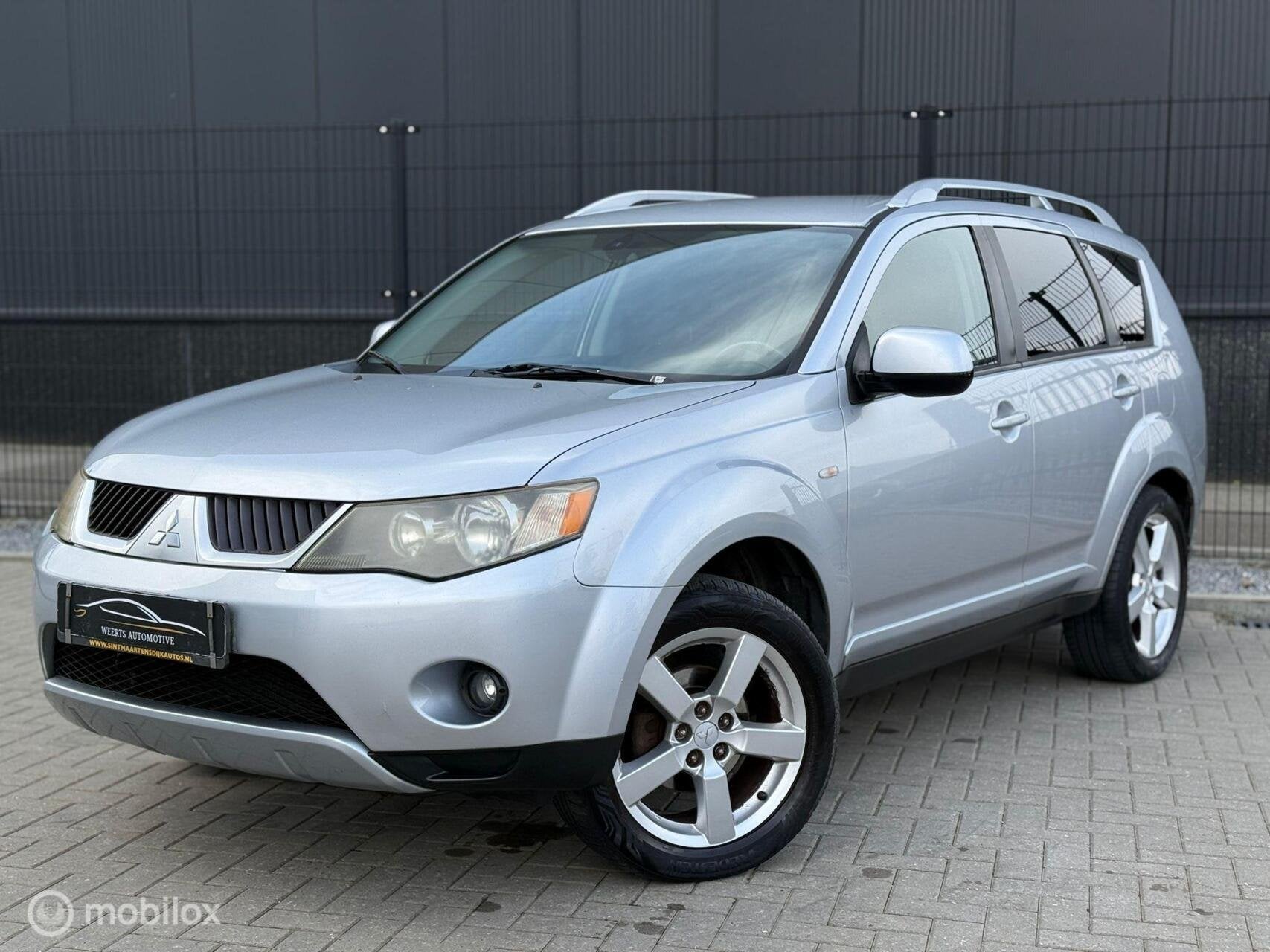 Mitsubishi Outlander 2.4 Intense+ |4WD|7-persoons|NAP|, Stof, Zwart, 4 cilinders, 7 stoelen