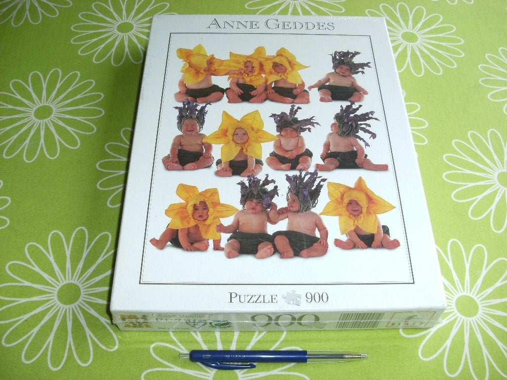 Nieuw in seal: Anne Geddes puzzel - 12 zonnebloemkinderen, Ophalen of Verzenden, 500 t/m 1500 stukjes, Nieuw, Legpuzzel