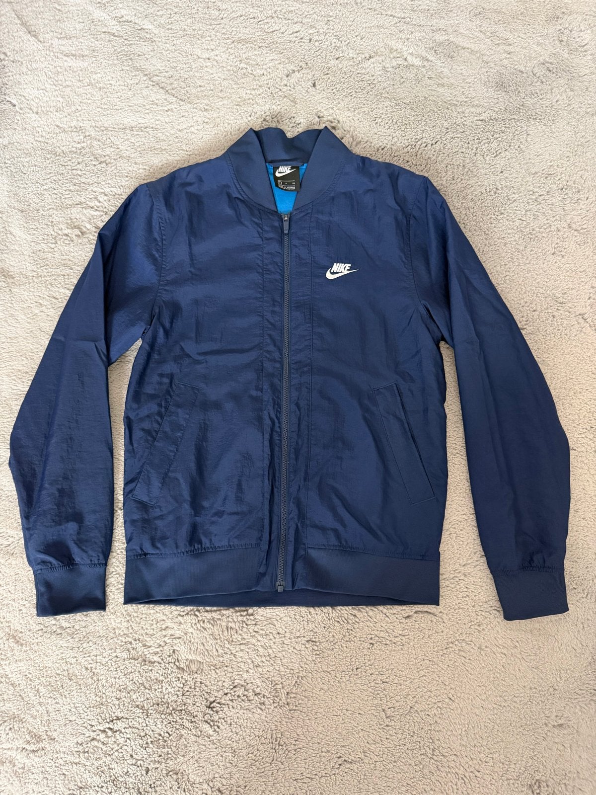 Nike Blauwe Jas Maat S - Ongebruikt, Ophalen of Verzenden, Nieuw, Maat 46 (S) of kleiner, Blauw